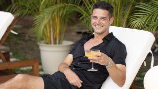 Wells Adams holds a margarita on Bachelor in Paradise Season 10.