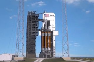 Artist's concept of a Delta 4 Heavy rocket standing poised on the pad ready to launch NASA's Exploration Flight Test-1 (EFT-1). The first flight of Orion is now slated for December 2014. 