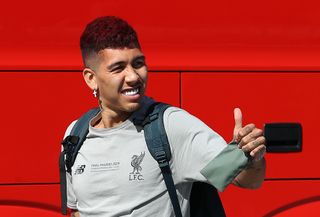 Roberto Firmino gives a thumbs-up gesture