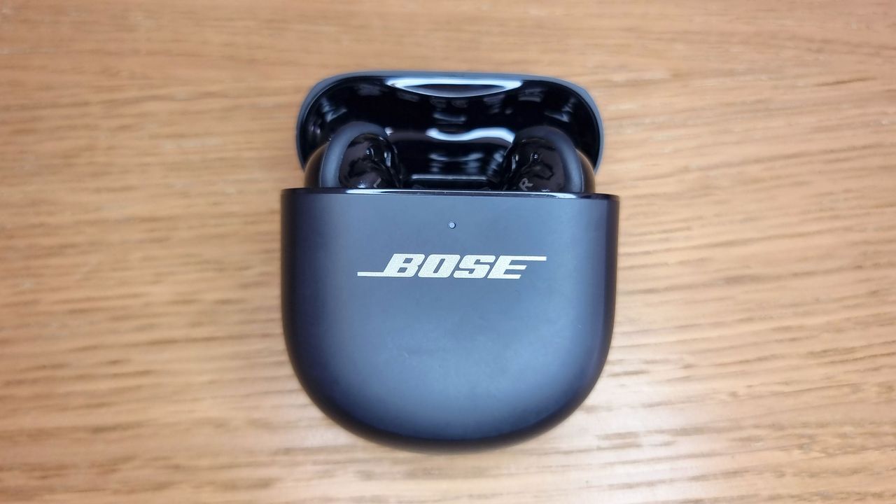A picture of the the Bose QuietComfort Ultra (Gen 2) earbuds in an open charging case