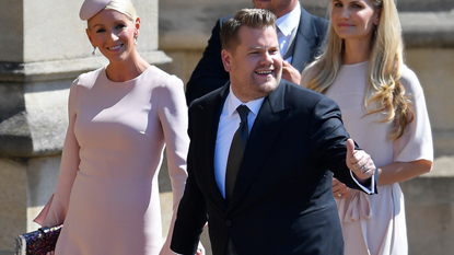 British presenter James Corden and Julia Carey arrive for the wedding ceremony of Britain's Prince Harry, Duke of Sussex and US actress Meghan Markle at St George's Chapel, Windsor Castle, in Windsor, on May 19, 2018. 