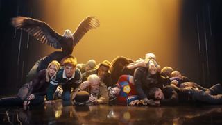 The cast of Peacemaker season 2 laying on the floor in a pile with Eagly perched on top in the final shot of the season 2 intro