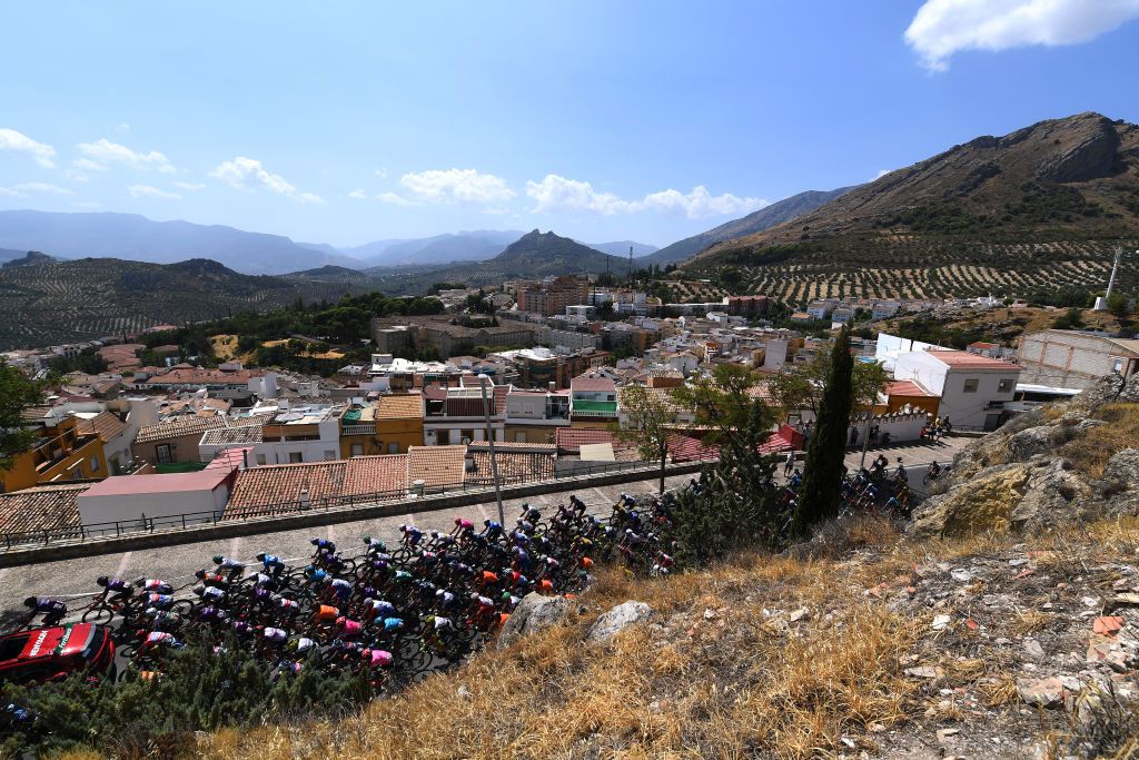 CORDOBA SPAIN AUGUST 26 A general view of the peloton passing through Jan city landscape during the 76th Tour of Spain 2021 Stage 12 a 175 km stage from Jan to Crdoba lavuelta LaVuelta21 on August 26 2021 in Cordoba Spain Photo by Tim de WaeleGetty Images