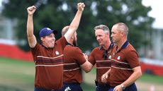Matt Fitzpatrick & Tyrrell Hatton of Europe celebrate with captain Luke Donald & Vice Captain Alex Noren after their fourball victory on the second day of the 2025 Ryder Cup