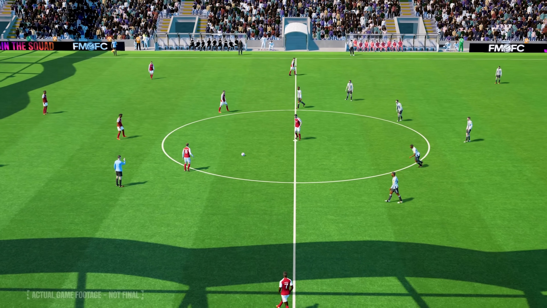 A screenshot of FM26 gameplay showing two teams on the pitch, with one about to kick off