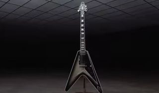 A silverburst Gibson Flying V guitar