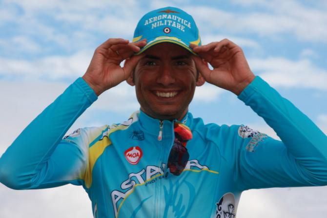 A happy Simone Ponzi (Astana) on the podium after winning stage 1 at the Vuelta a Burgos