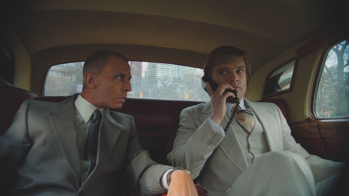 Roy Cohn (Jeremy Strong) and Donald Trump (Sebastian Stan) (L-R) in a car in &quot;The Apprentice&quot; movie