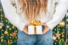 A woman hiding a Christmas present behind her back