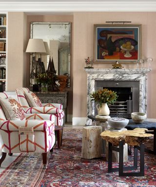 Living room with patterned chairs and antiques in Kit Kemp's house