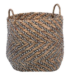 Woven basket for the floor with black and white chevron style accents 