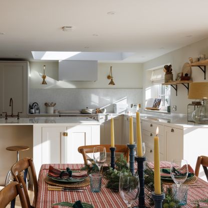 kitchen with farmhouse table decorated for christmas