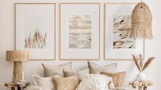 Natural materials lighting in laid-back bedroom scheme, with framed wall art of natural beachscape inspired moments.