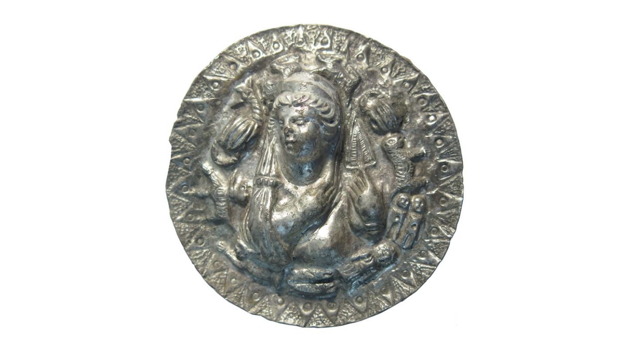 The portrayal of the ancient Greek goddess Aphrodite at the center of the medallion has been identified from her depictions in other iconography from the time.