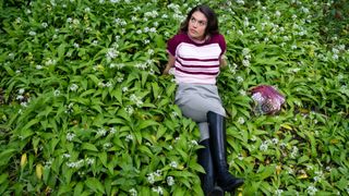 Mariette lying in what appeared to be a bed of wild garlic.