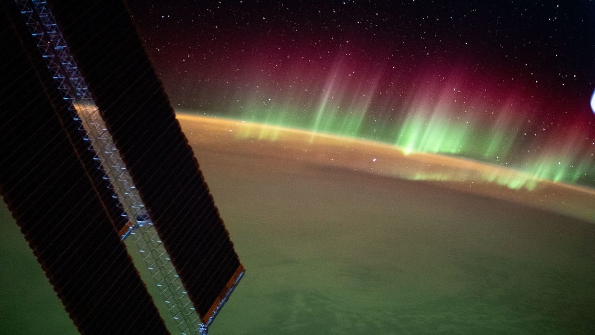A view of the aurora australis and the space station's solar arrays captured on Aug. 2, 2021, above the southern Indian Ocean.