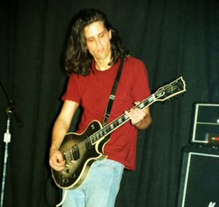 Adam Jones performs onstage with Tool at Club Lingerie in Hollywood on June 2, 1992