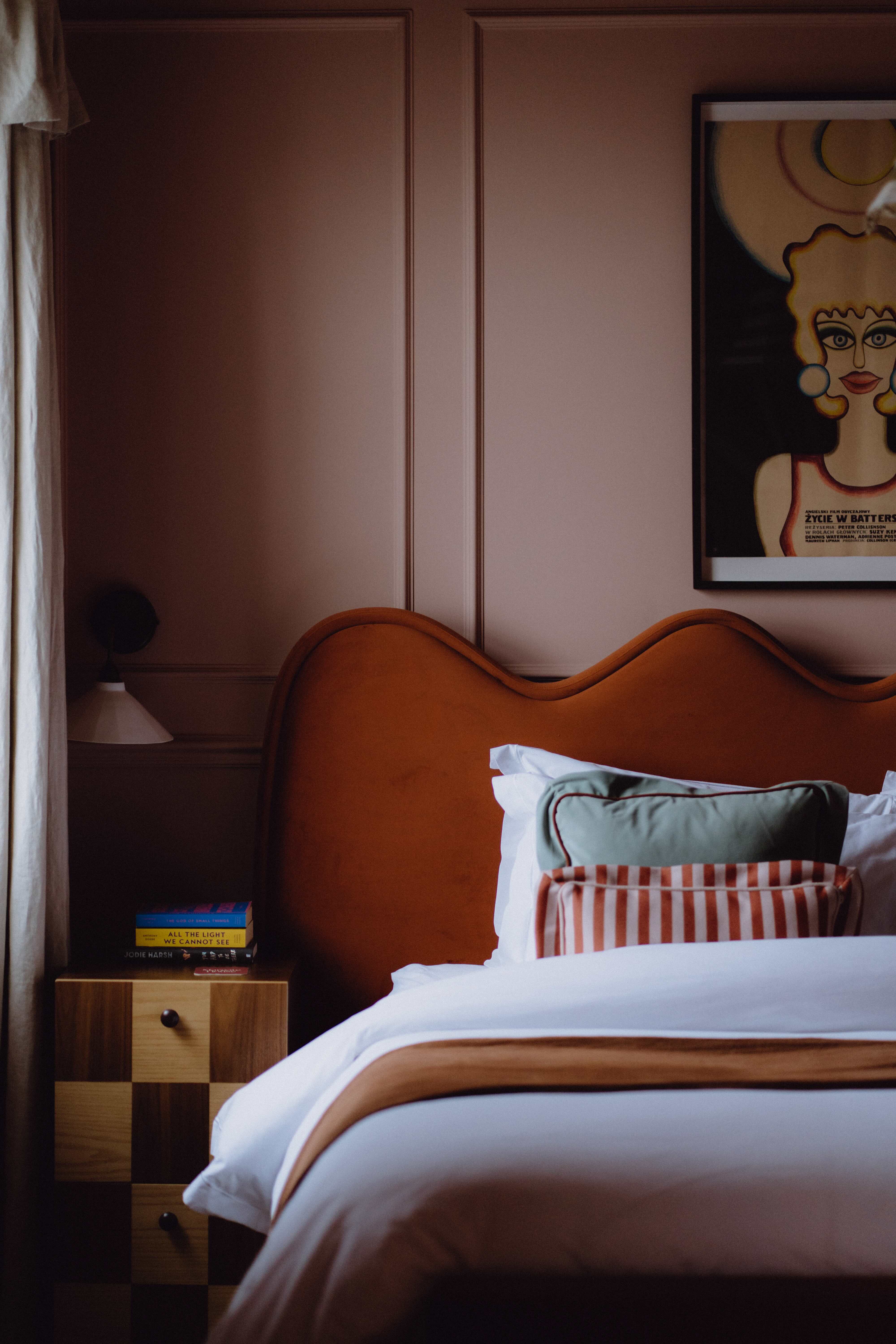 A contemporary bedroom with wall lighting