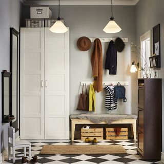 bootroom or hallway storage idea with large wardrobe, coat hook and storage bench all by ikea
