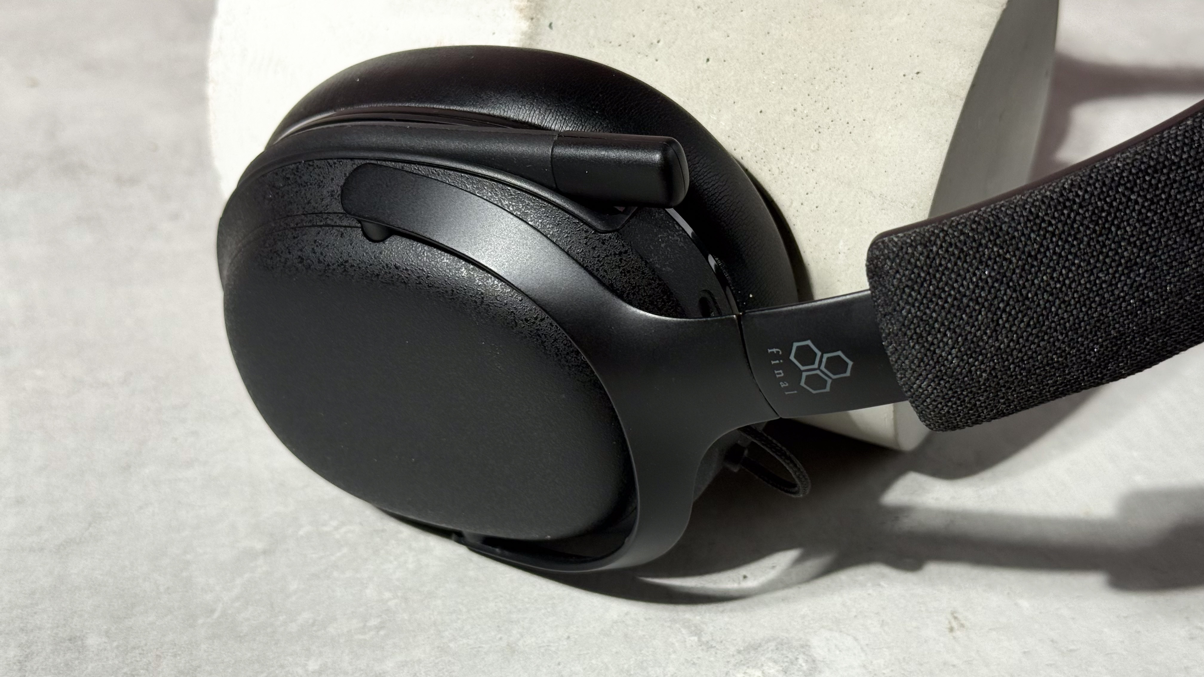 A closeup of the Final VR3000 EX for Gaming's left earcup with the mic folded away.