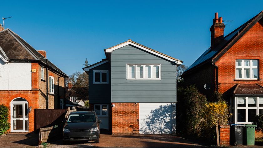 Houses and gardens in Surrey UK at sunrise - blue sky in morning light