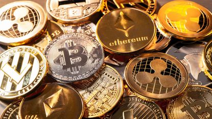 Gold coins with cryptocurrency logos