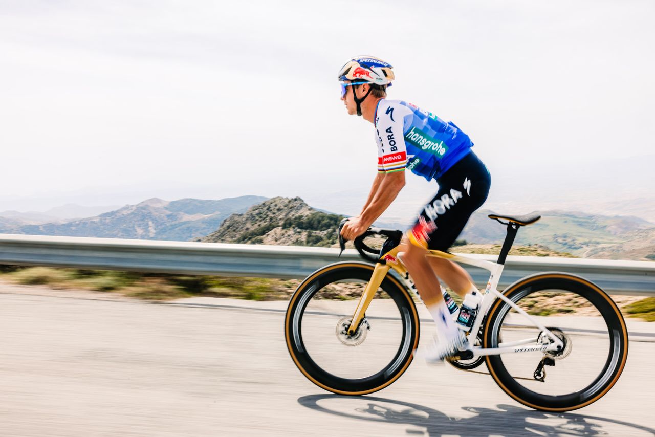 Red Bull Bora Hansgrohe kit for the 2026 Tour de France, featuring a blue gradient on a white jersey with black shorts