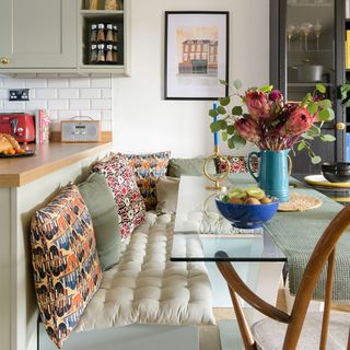 dining room with bench seating and glass dining table