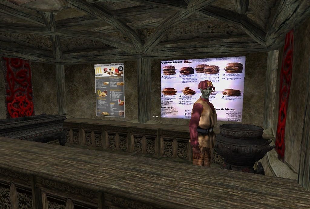 A dark elf serves burgers in a Morrowind mod