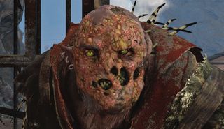 Best Lord of the Rings games — a close-up of a particularly grotesque Orc warchief, whose face looks like it was melted three times over.