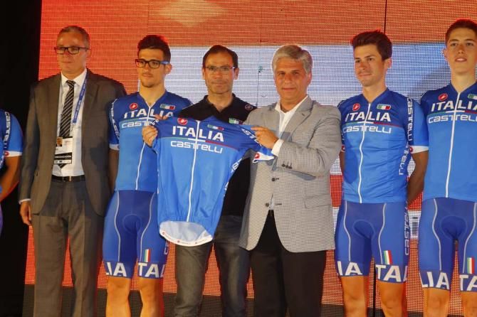 Italian national coach Davide Cassani shows off the Italian jersey