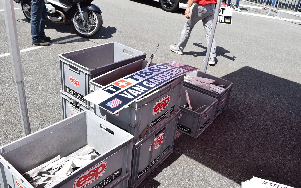 Each follow car has their respective rider's name board attached at the stage start
