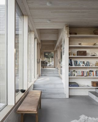 interior with timber and books atSaltviga House, on the south coast of Norway by Architects Kolman Boye Architects