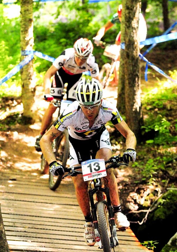 Riders descend over one of many wooden bridges on the Windham World Cup course
