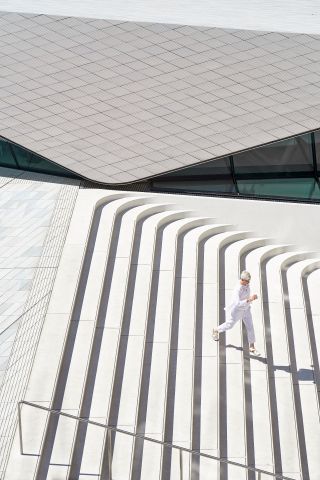 Aerial view of woman walking down outdoor stairs