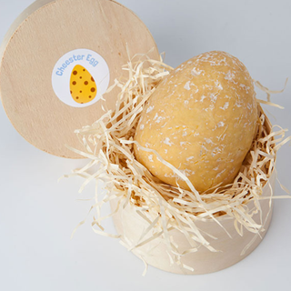 cheester egg cream and white colour chocolate in wooden bowl