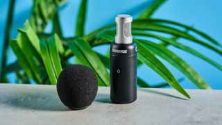 the black shure movemic 88+ for phone-first content creation, with wireless bluetooth connection and a receiver for camera connection