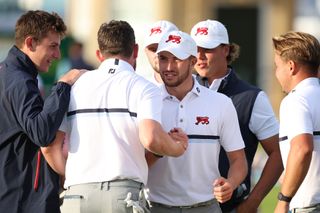 Maguire and McClean shake hands on the 18th green