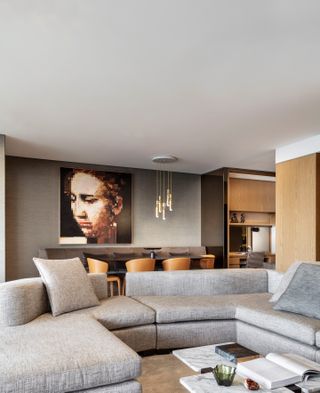 A living room with a long sectional