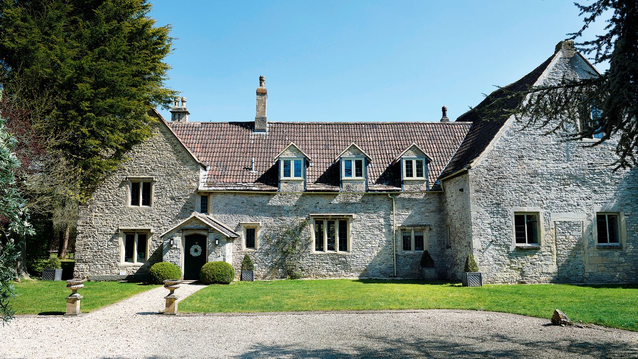 exterior of Grade II* listed 12th century Cotswolds country house