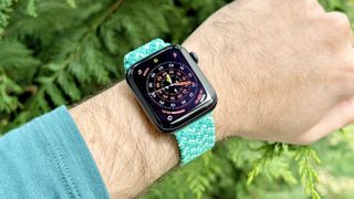 Close-up of the Solace Imperium Adapt watch strap on an Apple Watch SE 3 in 'Calypso' green