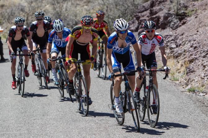 A group tries to bring back the leader on the last part of the climb.