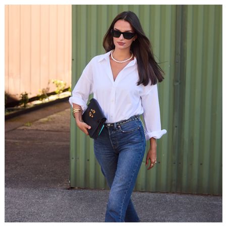 women wearing button-down shirts and jeans 