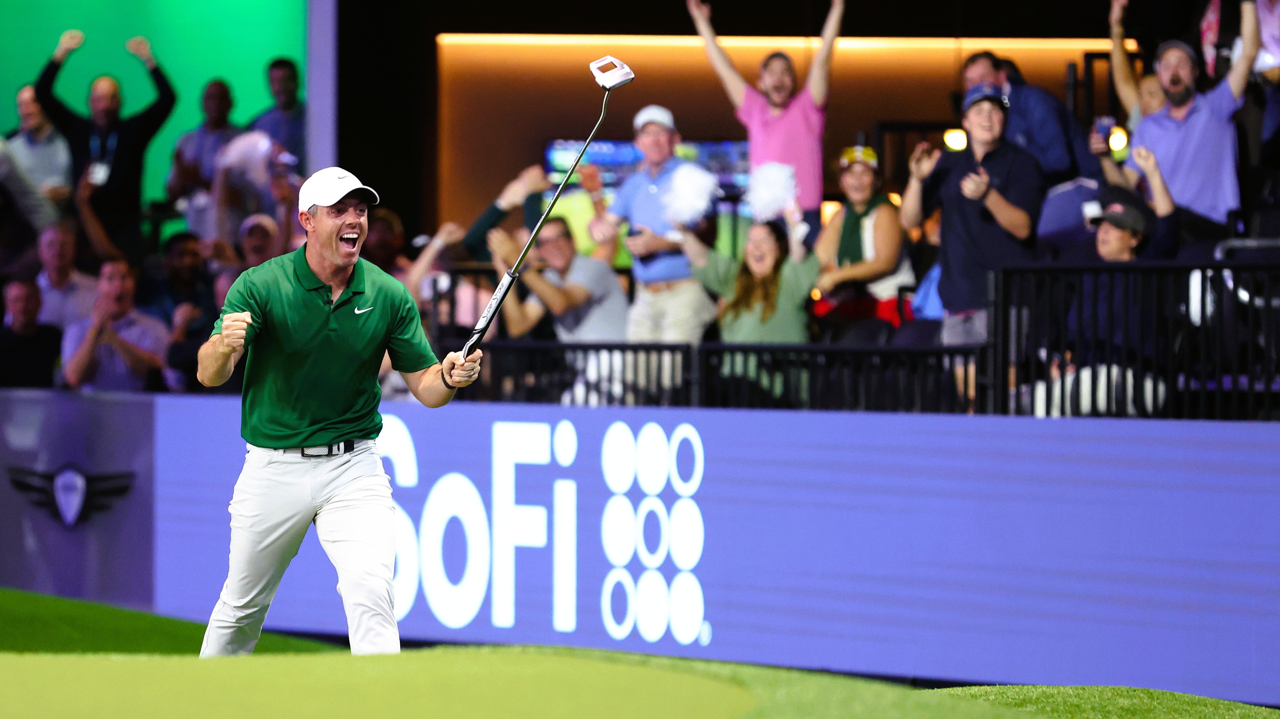 Rory McIlroy of Boston Common Golf celebrates teammate Keegan Bradley's chip-in on the 10th hole during their TGL match against The Bay Golf Club on February 17, 2025&nbsp;