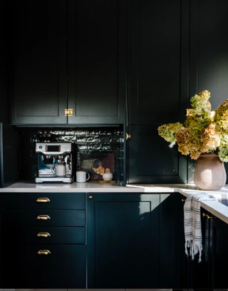 dark green cabinets and tiles