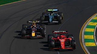 Charles Leclerc of Monaco driving the (16) Ferrari SF-24 leads Sergio Perez of Mexico driving the (11) Oracle Red Bull Racing RB20 and Fernando Alonso of Spain driving the (14) Aston Martin AMR24 Mercedes