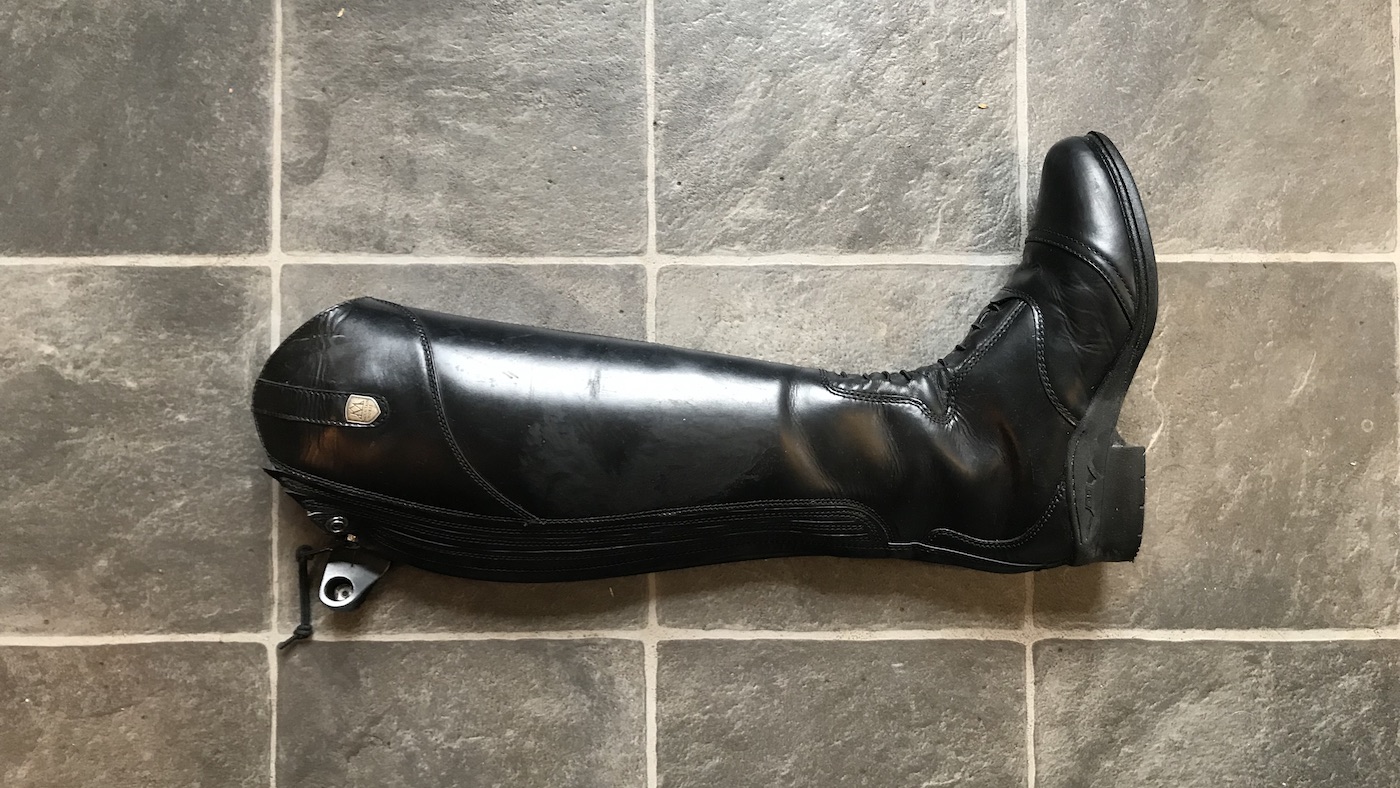 There is a zipper down the back, and elasticated panels to ensure a perfect fit