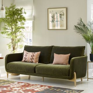 Green velvet sofa in living room