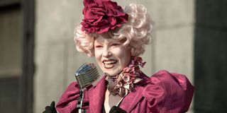 Elizabeth Banks as Effie Trinket announcing tributes in The Hunger Games