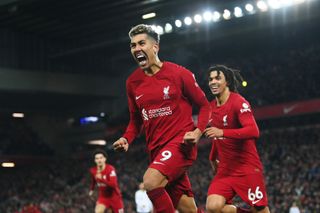 Roberto Firmino celebrates after scoring for Liverpool against Manchester United in March 2023.